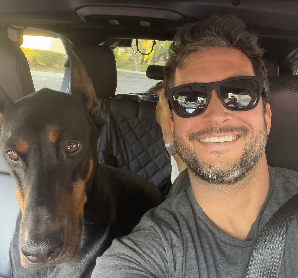 Cory, owner of Dumb House Rescue, with his dog